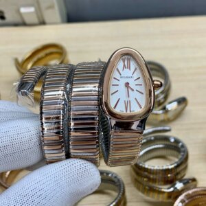 white dial watch with two tone chain