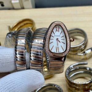white diamond bezel watch with two tone chain