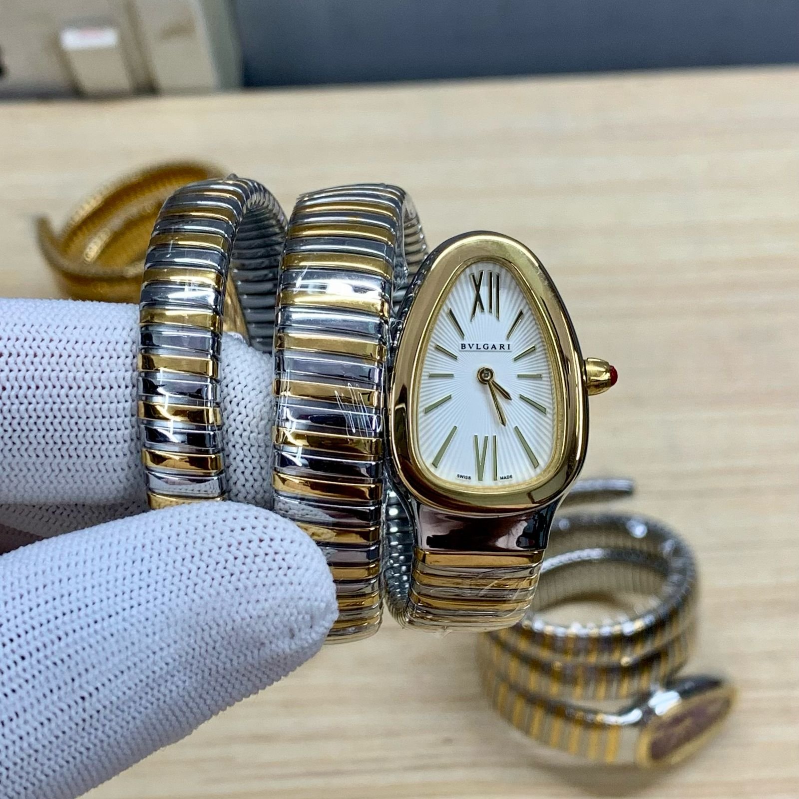 white dial watch with two tone chain