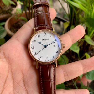 black dial watch with brown leather strap