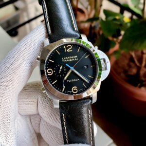 silver bezel with black leather strap